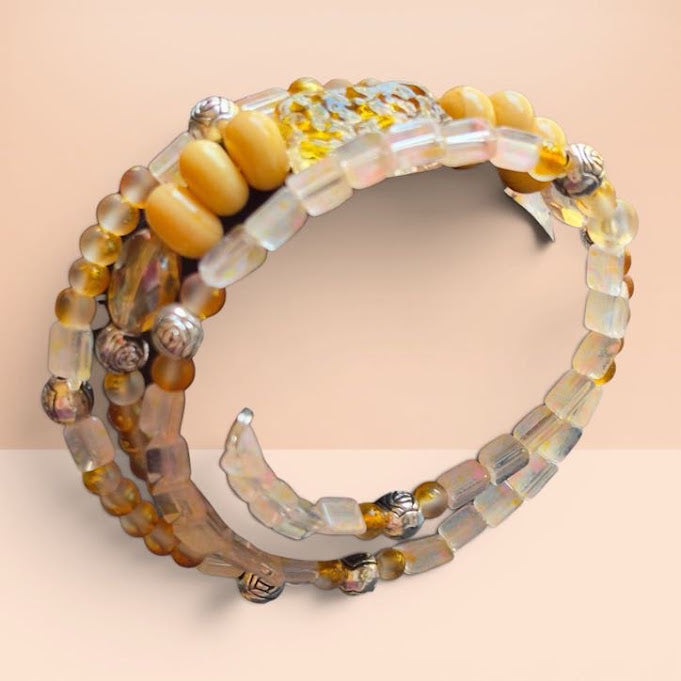 Set of beaded bracelets on a beige background