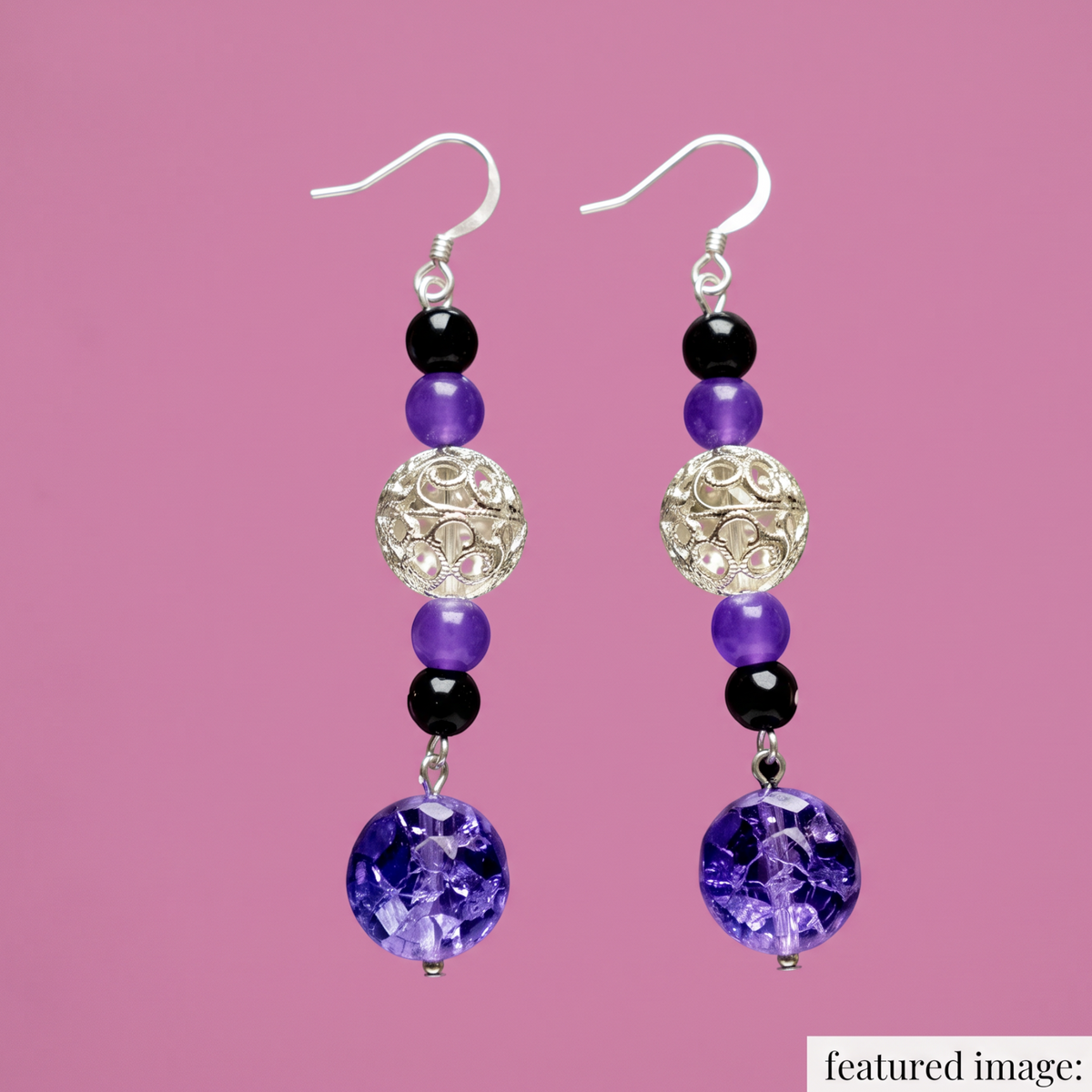 Heartfelt Creations drop earrings featuring black and purple beads with silver filigree spheres and glass pendants