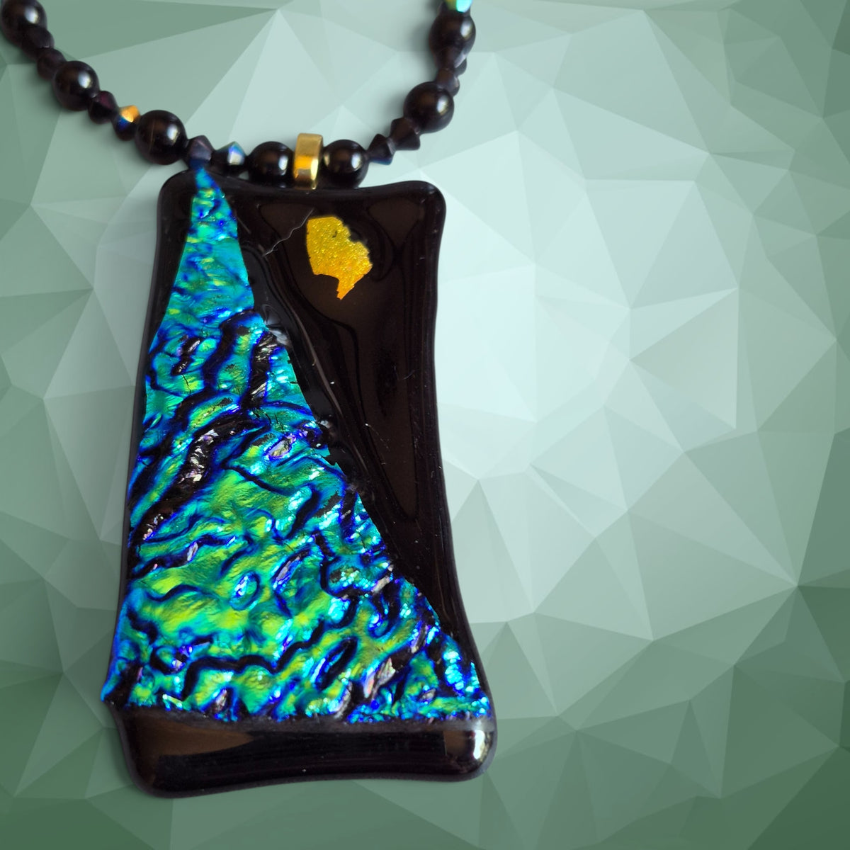 Heartfelt Creations artisan dichroic glass pendant necklace with iridescent blue and green glass beads on black chain