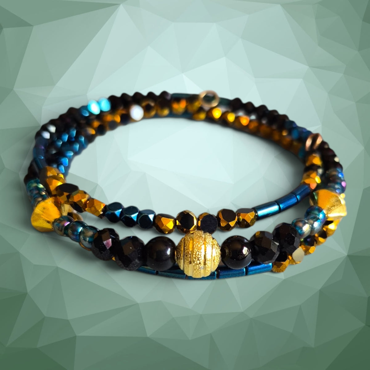 Heartfelt Creations artisan wrap bracelet featuring black, metallic blue, and shimmering gold glass beads.