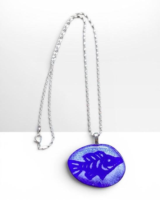 Heartfelt Creations handcrafted enameled deep blue fused glass fish pendant necklace with textured details on a silver chain.