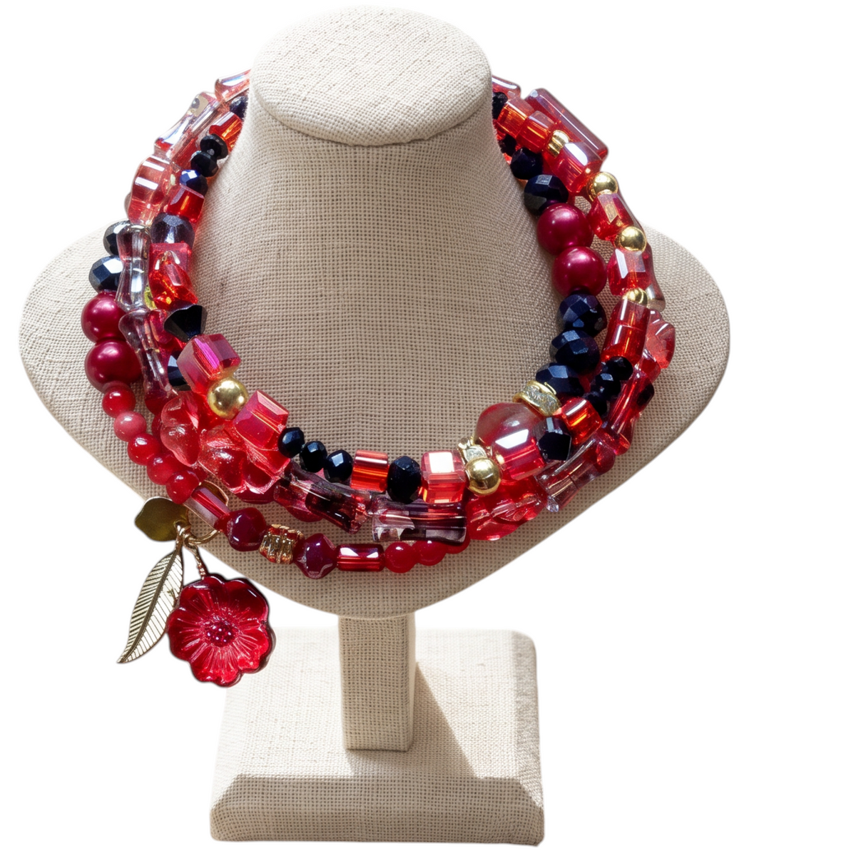 Heartfelt Creations multi-strand wrap bracelet with red, black, and gold beads, gold feather, and red flower charm.