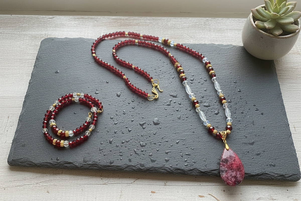 Heartfelt Creations garnet bead necklace and bracelet set with a pink teardrop gemstone pendant and gold accents.
