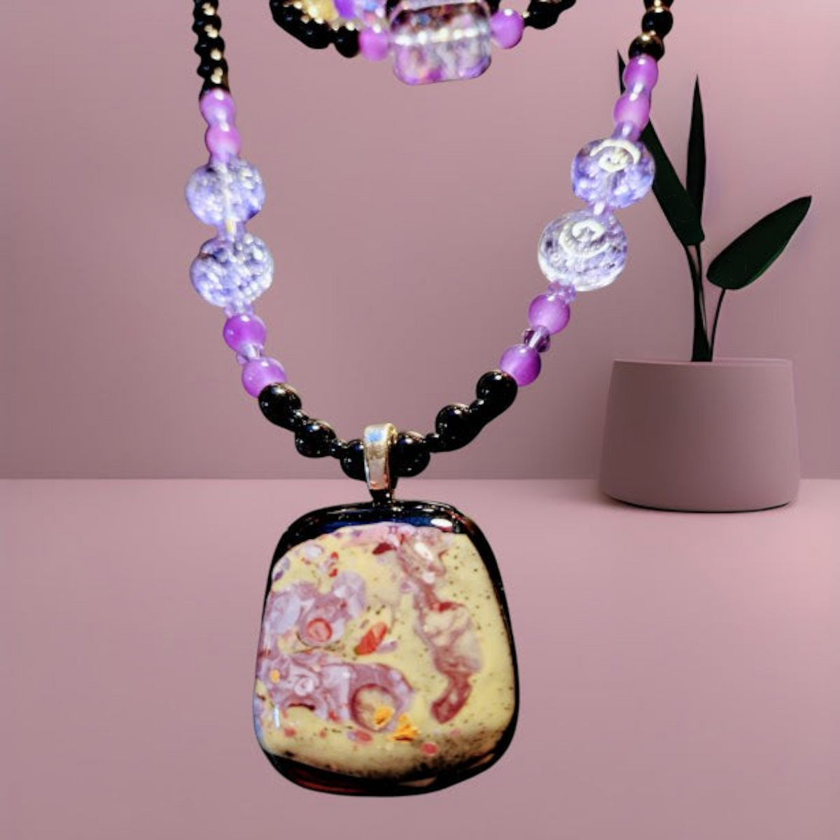 "Heartfelt Creations handcrafted beaded necklace and bracelet set with purple and black glass beads. Includes matching earrings and a unique handmade fused glass pendant created by a friend."