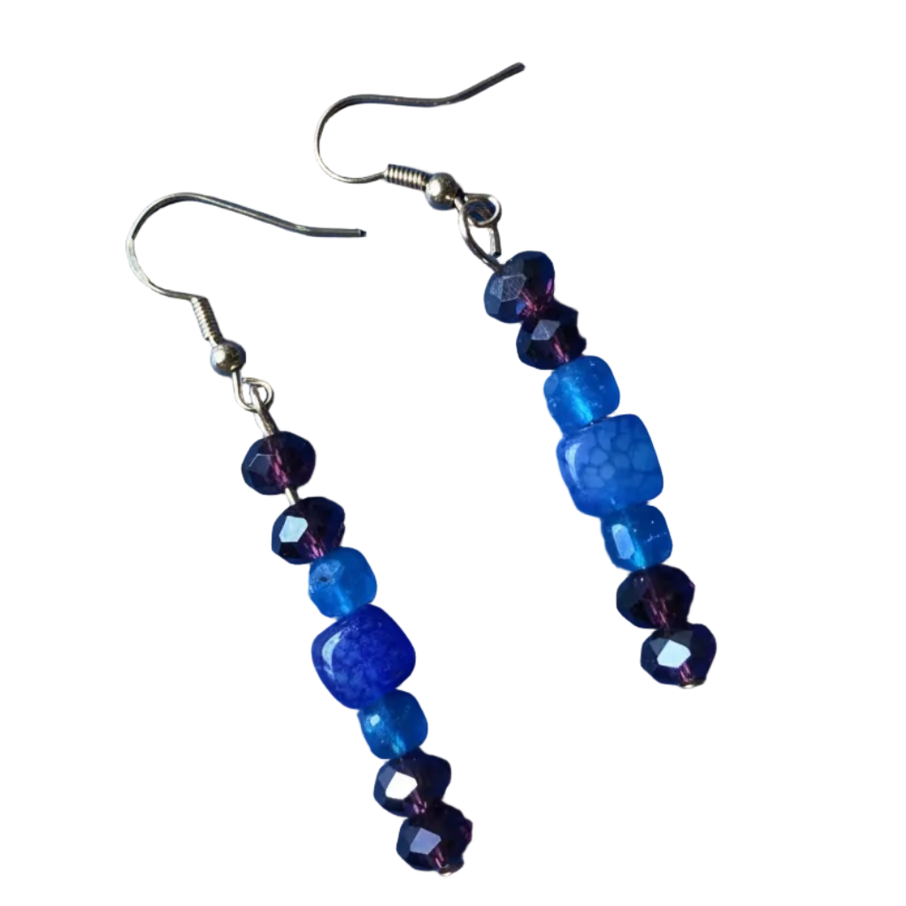 Heartfelt Creations' most off-beat 3-piece handmade and designed jewelry set.  The bohemian beaded necklace, earring and bracelet set with deep red, brown, and blue stones. Necklace features a stacked stone pendant.