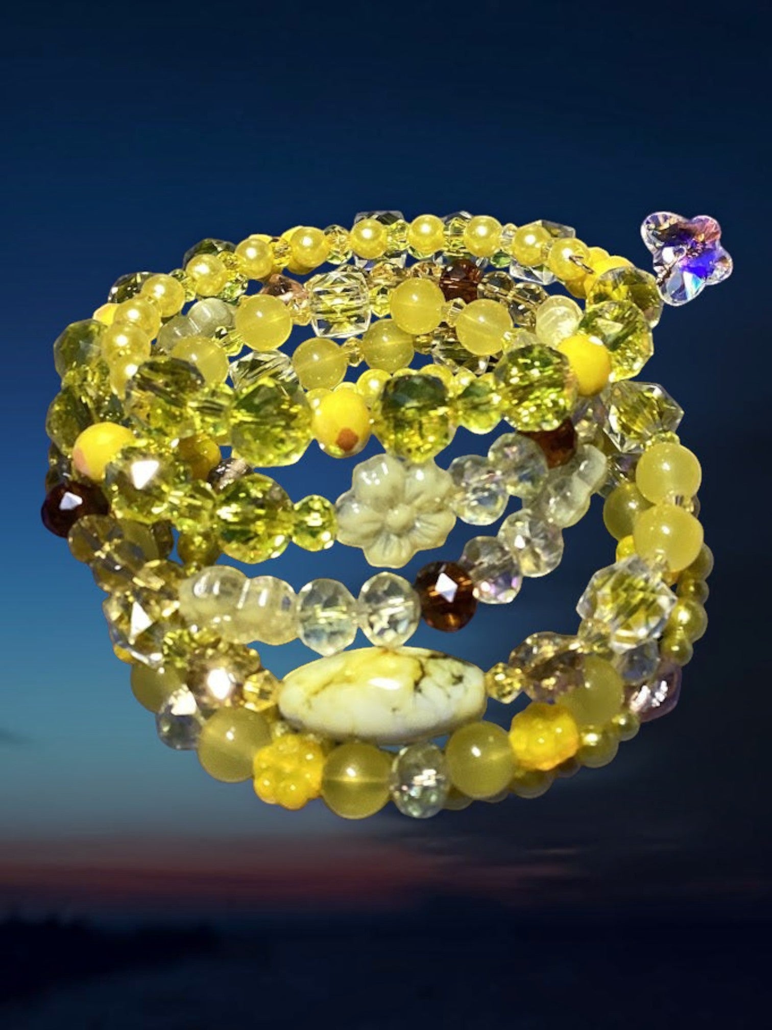 Multicolored beaded bracelet on a dark blue background
