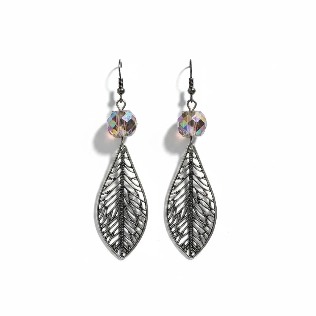 A pair of silver-toned dangle earrings with intricate filigree leaf-shaped pendants and faceted iridescent beads at the top, shown on a plain white background.