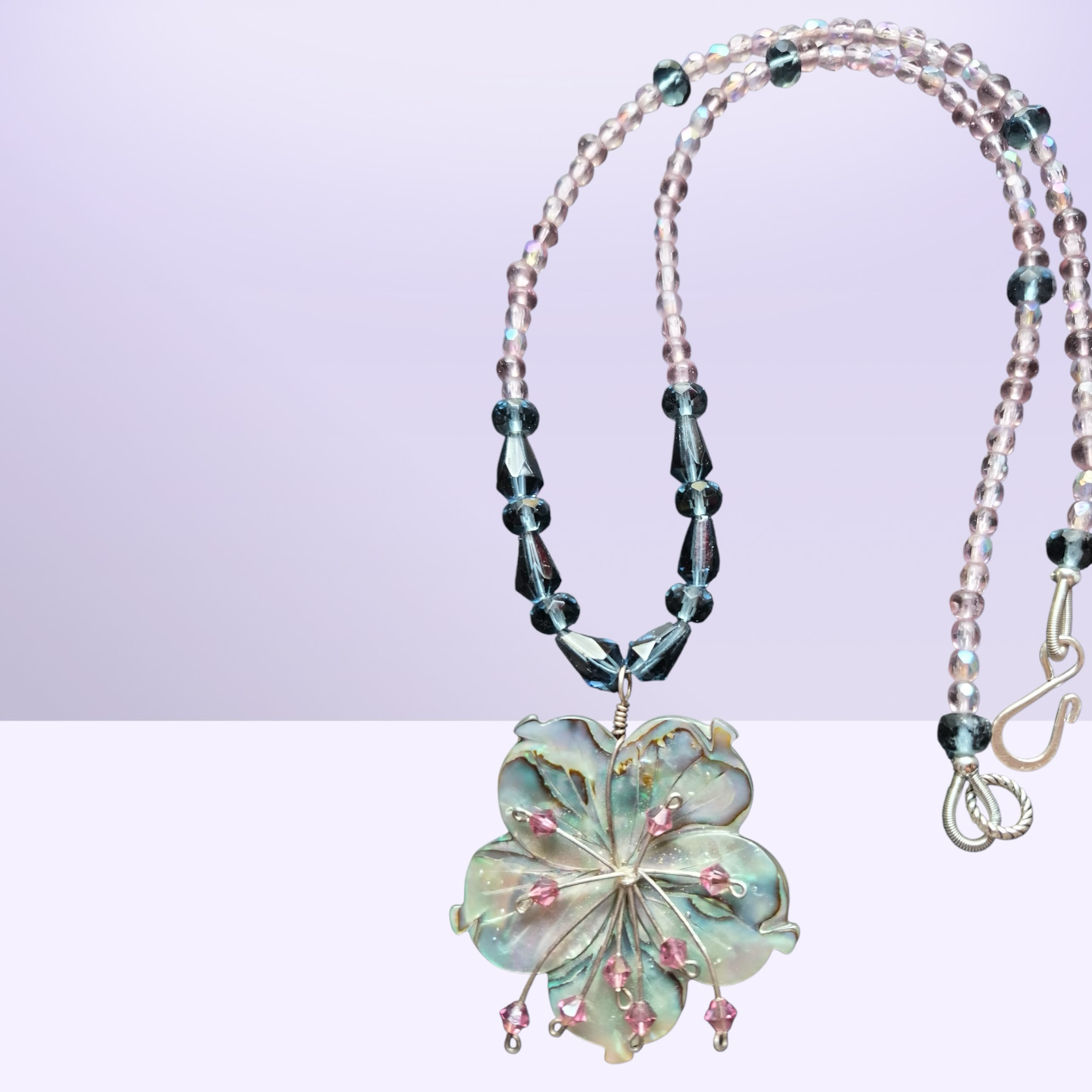 Heartfelt Creations abalone shell flower necklace with pink crystals and teal beads.