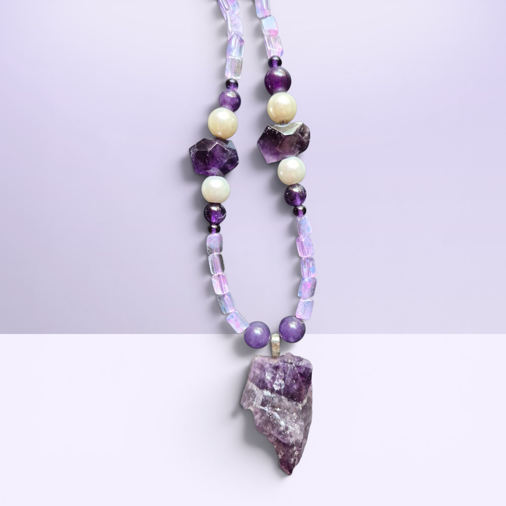 Heartfelt Creations bohemian amethyst pendant necklace with iridescent opal-style beads and lustrous pearls.