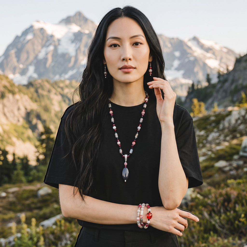 Heartfelt Creations artisan beaded necklace, bracelet, and drop earring set with red, black, and clear beads on a model