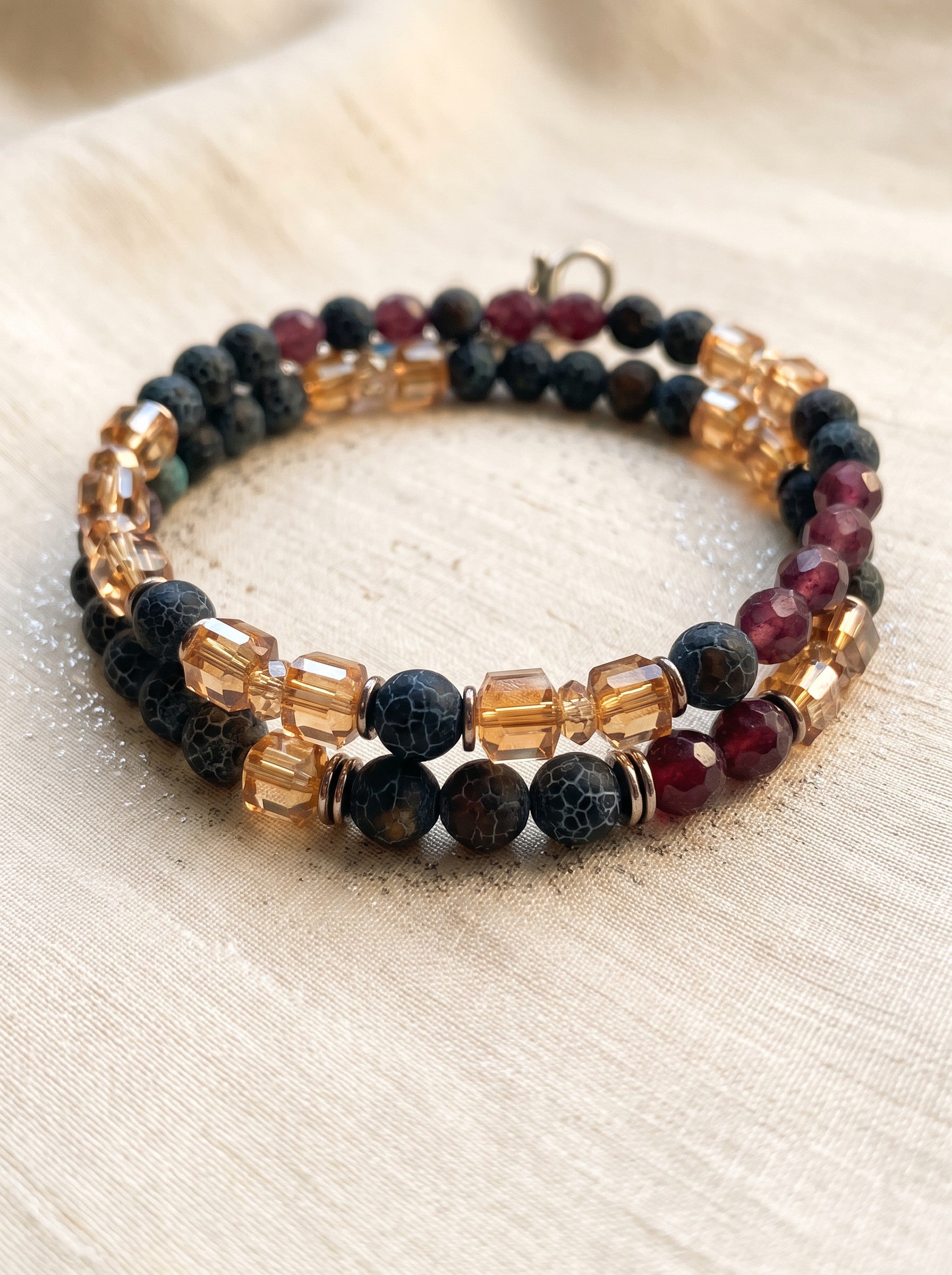 Heartfelt Creations artisan beaded bracelet featuring blue-grey agate, burgundy, and amber crystal cube beads.