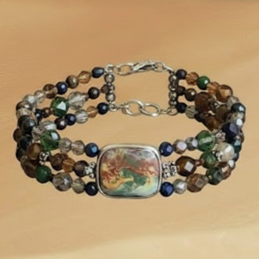Heartfelt Creations multi-strand beaded bracelet with a central marbled ceramic pendant and gold-tone hardware.