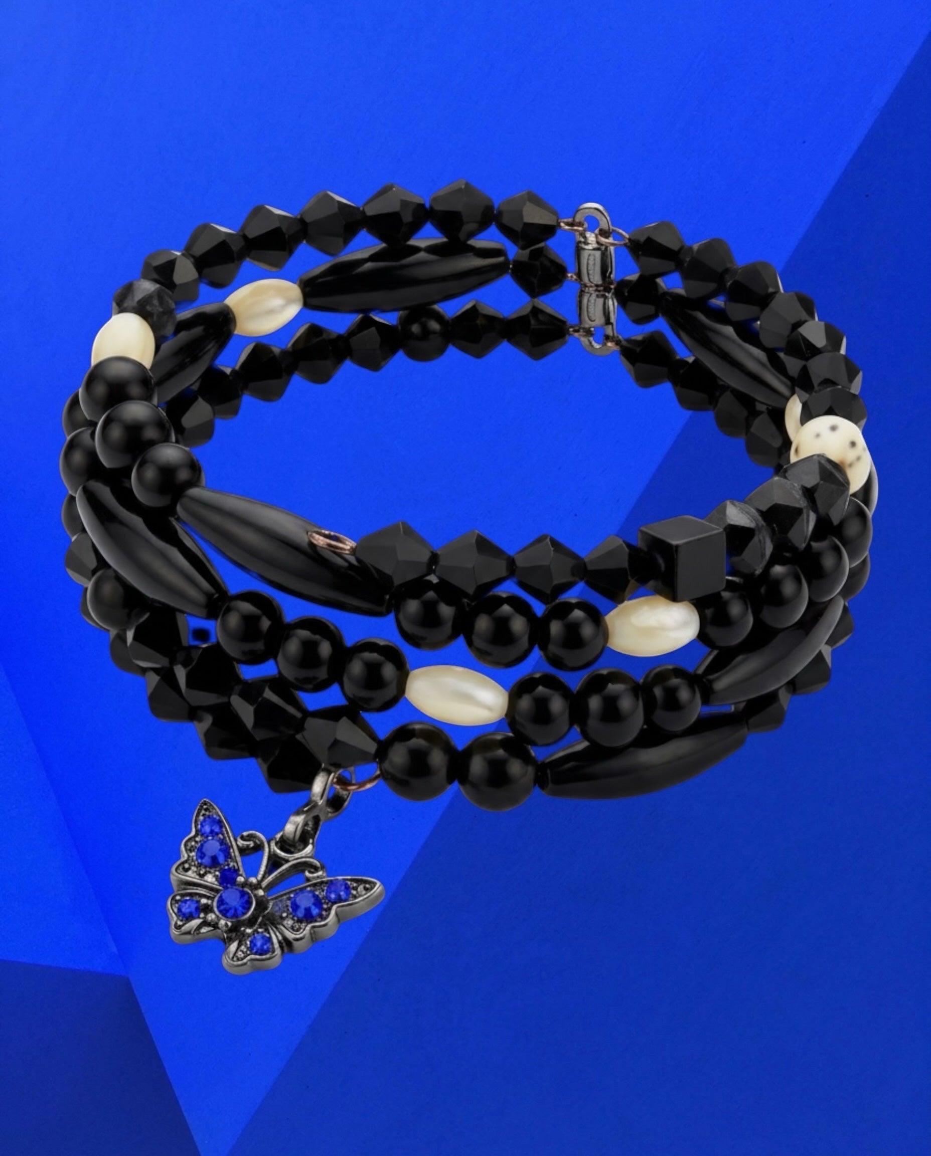Heartfelt Creations wrap-style bracelet featuring black beads, white Dalmatian Jasper, and a blue butterfly charm.
