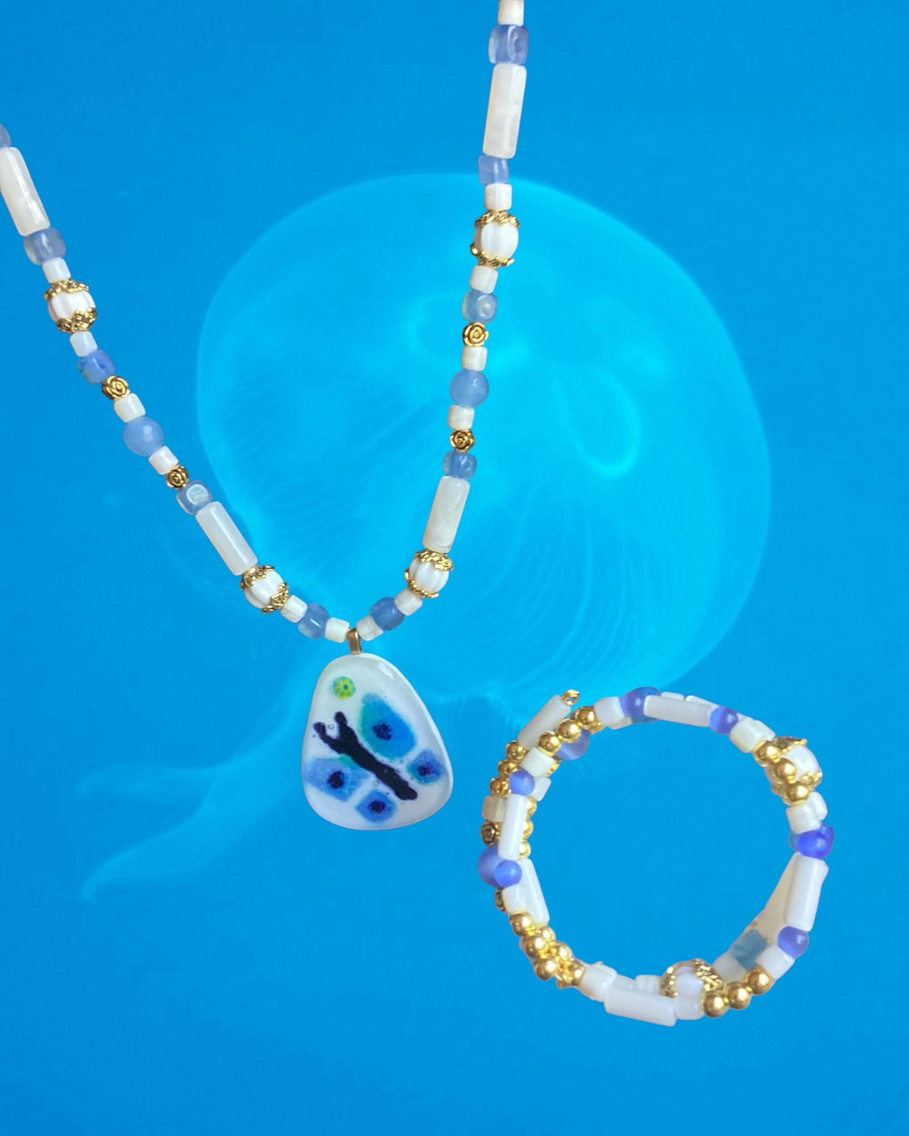 Heartfelt Creations handcrafted beaded necklace, earrings and bracelet set with a blue butterfly pendant and gold-tone accents.