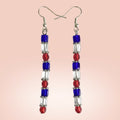 Heartfelt Creations handcrafted dangle earrings featuring red, white, and blue geometric beads with silver hooks.