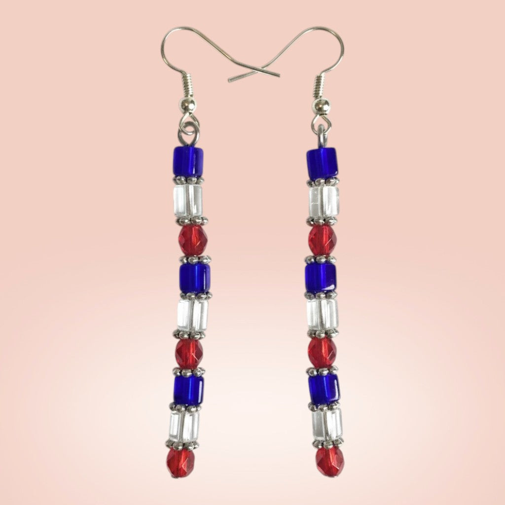 Heartfelt Creations handcrafted dangle earrings featuring red, white, and blue geometric beads with silver hooks.
