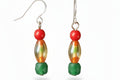 Heartfelt Creations handcrafted dangle earrings with red, multi-toned glass, and faceted green gemstone beads.