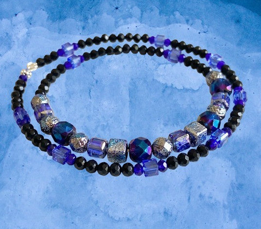 Heartfelt Creations artisan beaded necklace with iridescent blue and purple glass beads and faceted black crystals