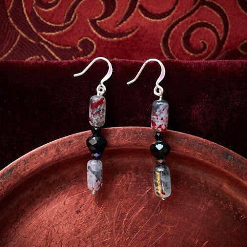 Heartfelt Creations artisan drop earrings with black faceted beads and red and grey hand-painted cylindrical beads