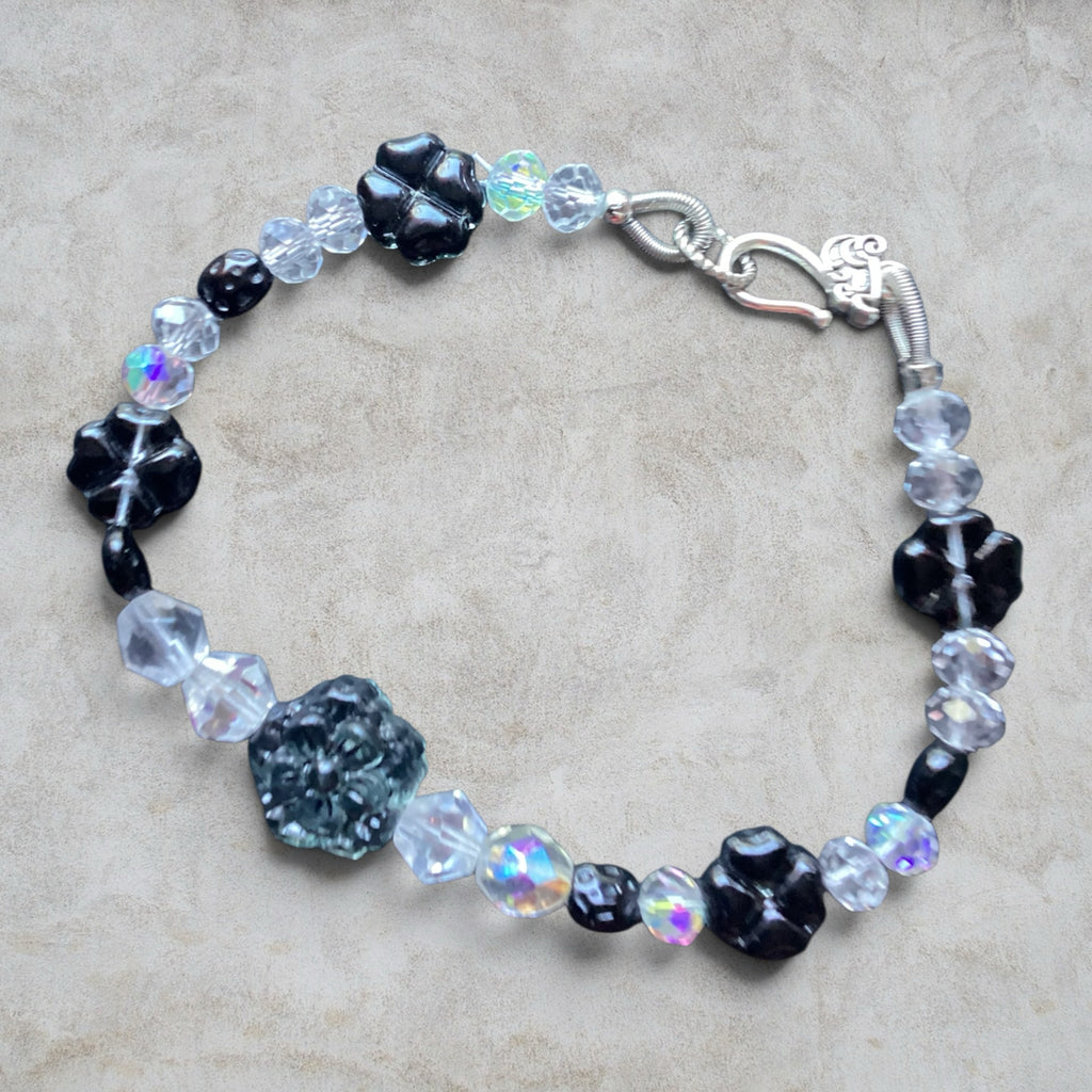 Heartfelt Creations beaded bracelet with black floral glass beads, iridescent crystals, and silver-tone clasp.