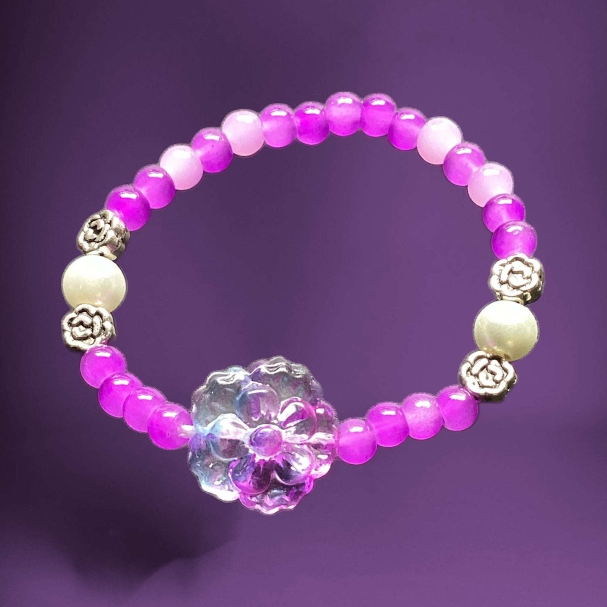 Heartfelt Creations beaded bracelet with pink and lavender gradient beads, faux pearls, rose charms, and iridescent floral centerpiece.