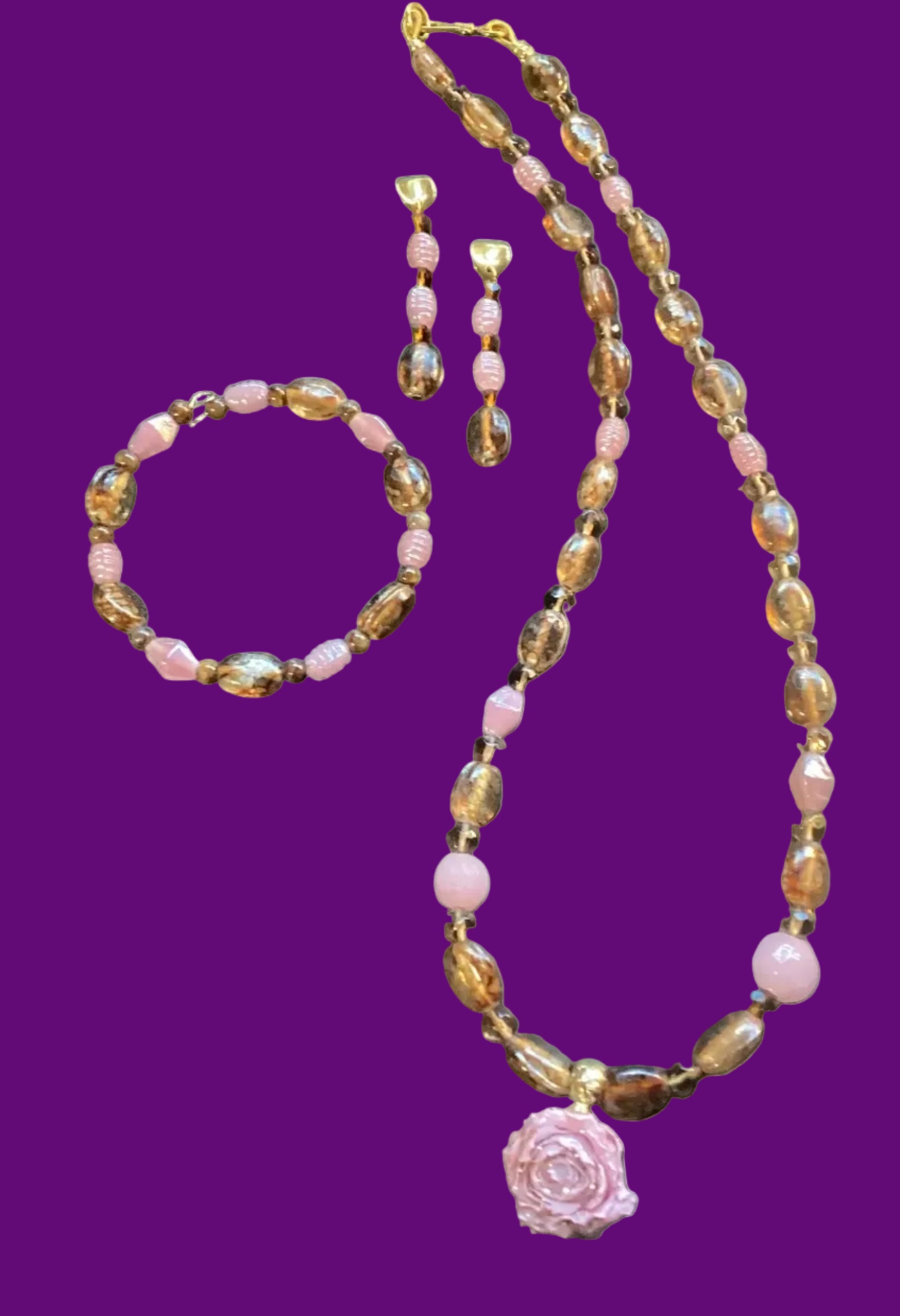 Heartfelt Creations three-piece jewelry set with amber and pink beads, rose pendant necklace, bracelet, and drop earrings.