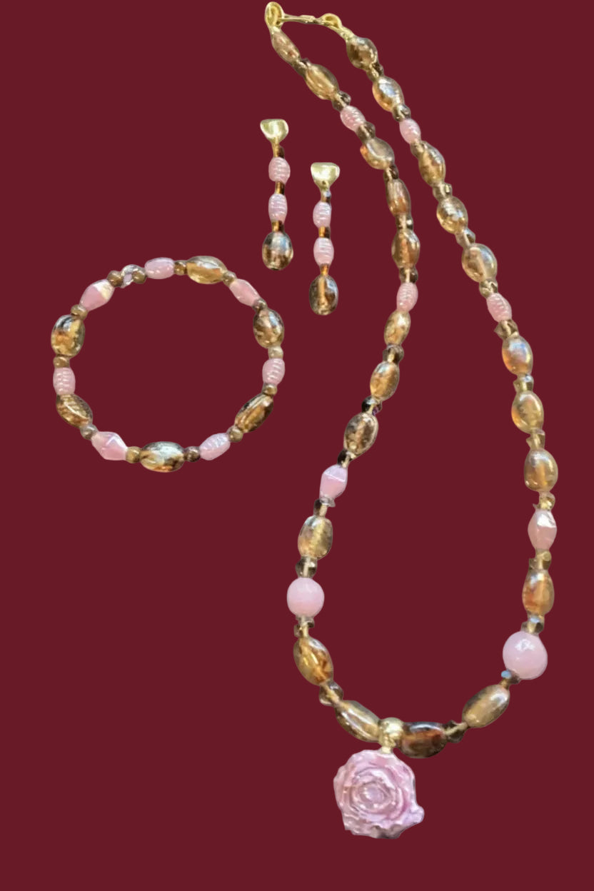Heartfelt Creations three-piece jewelry set with amber and pink beads, rose pendant necklace, bracelet, and drop earrings.