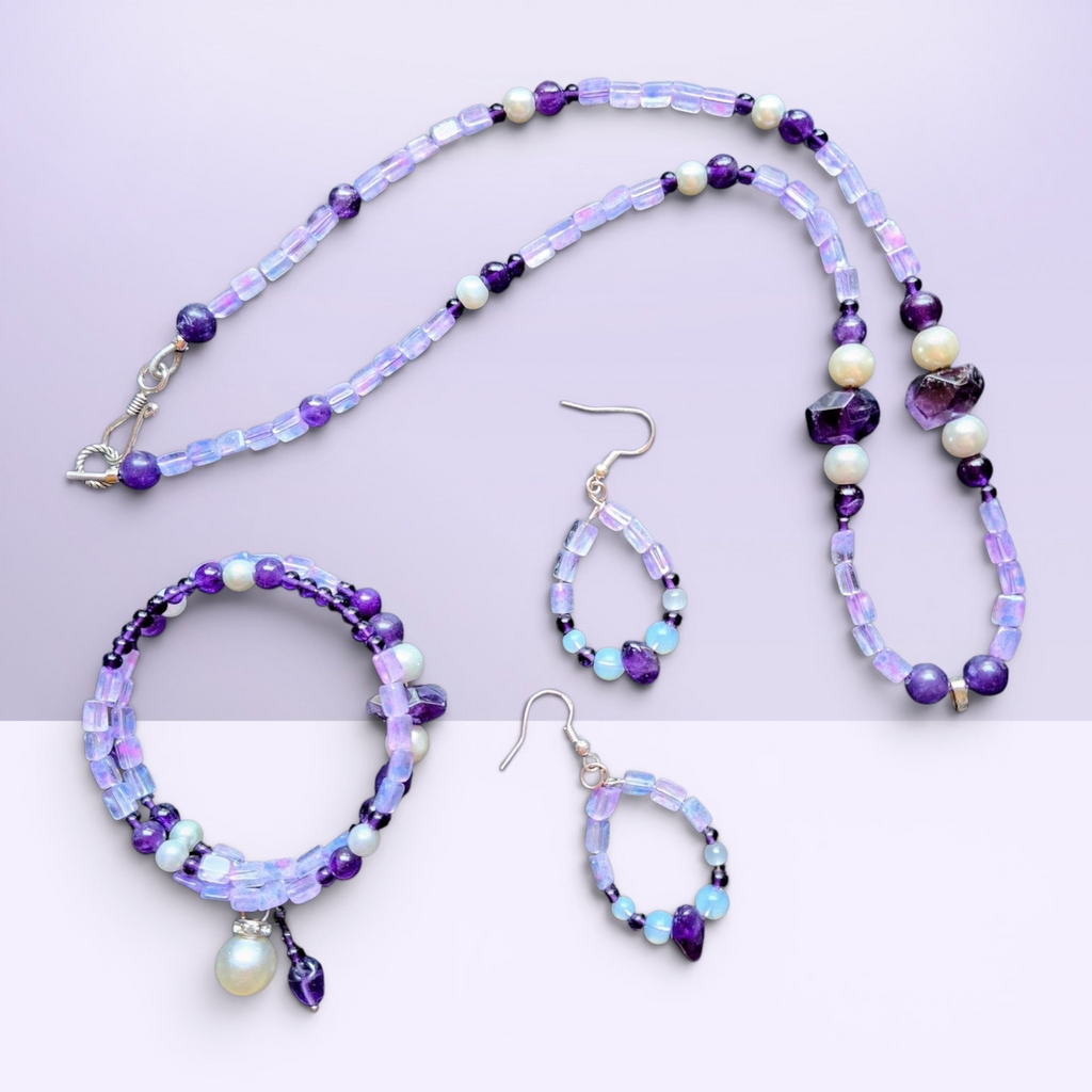 Heartfelt Creations bohemian jewelry set featuring amethyst, iridescent opal-style beads, and pearls in necklace, bracelet, and drop earrings.