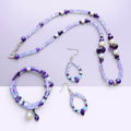 Heartfelt Creations bohemian jewelry set featuring amethyst, iridescent opal-style beads, and pearls in necklace, bracelet, and drop earrings.