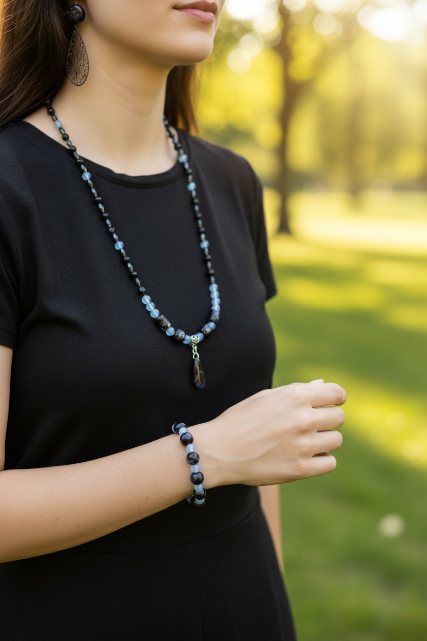 Heartfelt Creations elegant beaded necklace, bracelet, and earring set in black and light blue with silver-toned filigree charms.