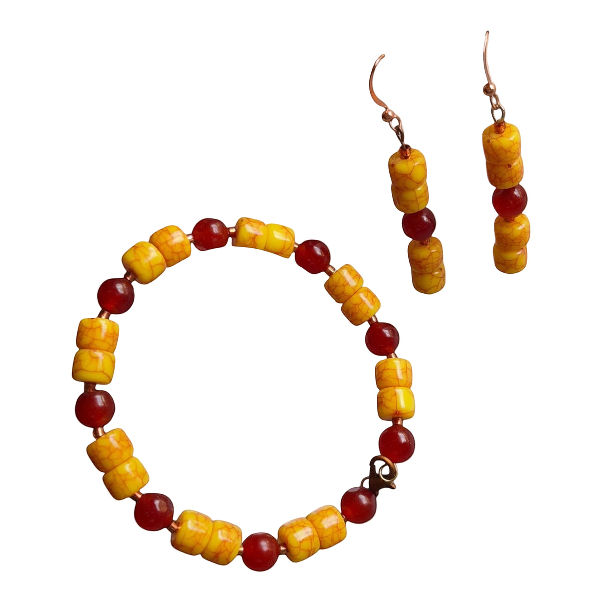 Heartfelt Creations jewelry set featuring a beaded bracelet and drop earrings with yellow crackle and red accent beads.
