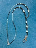 Heartfelt Creations beaded lanyard with black and light blue seed beads, floral accent, and silver-tone lobster clasp.