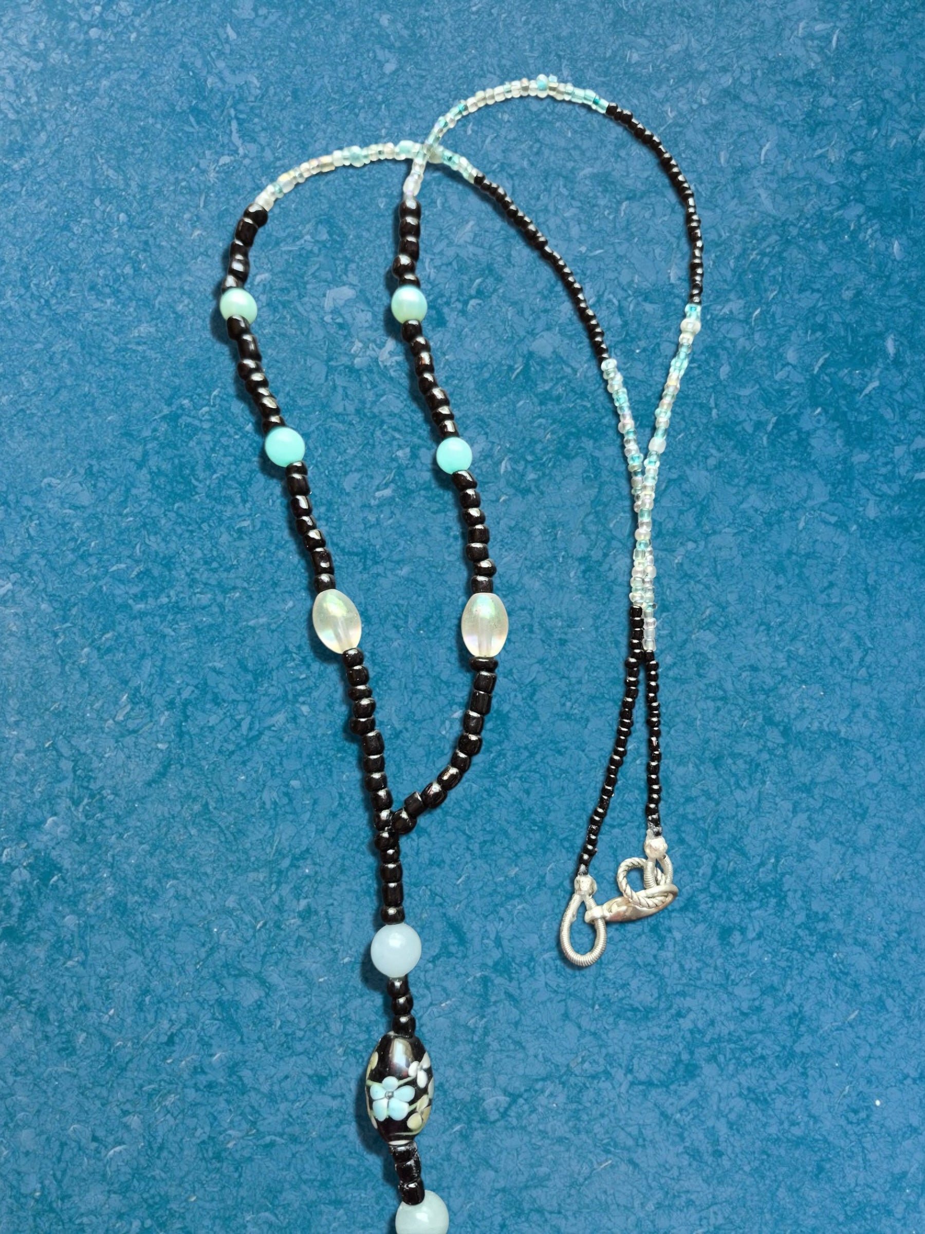 Heartfelt Creations beaded lanyard with black, light blue, and floral beads featuring a silver-tone lobster clasp.
