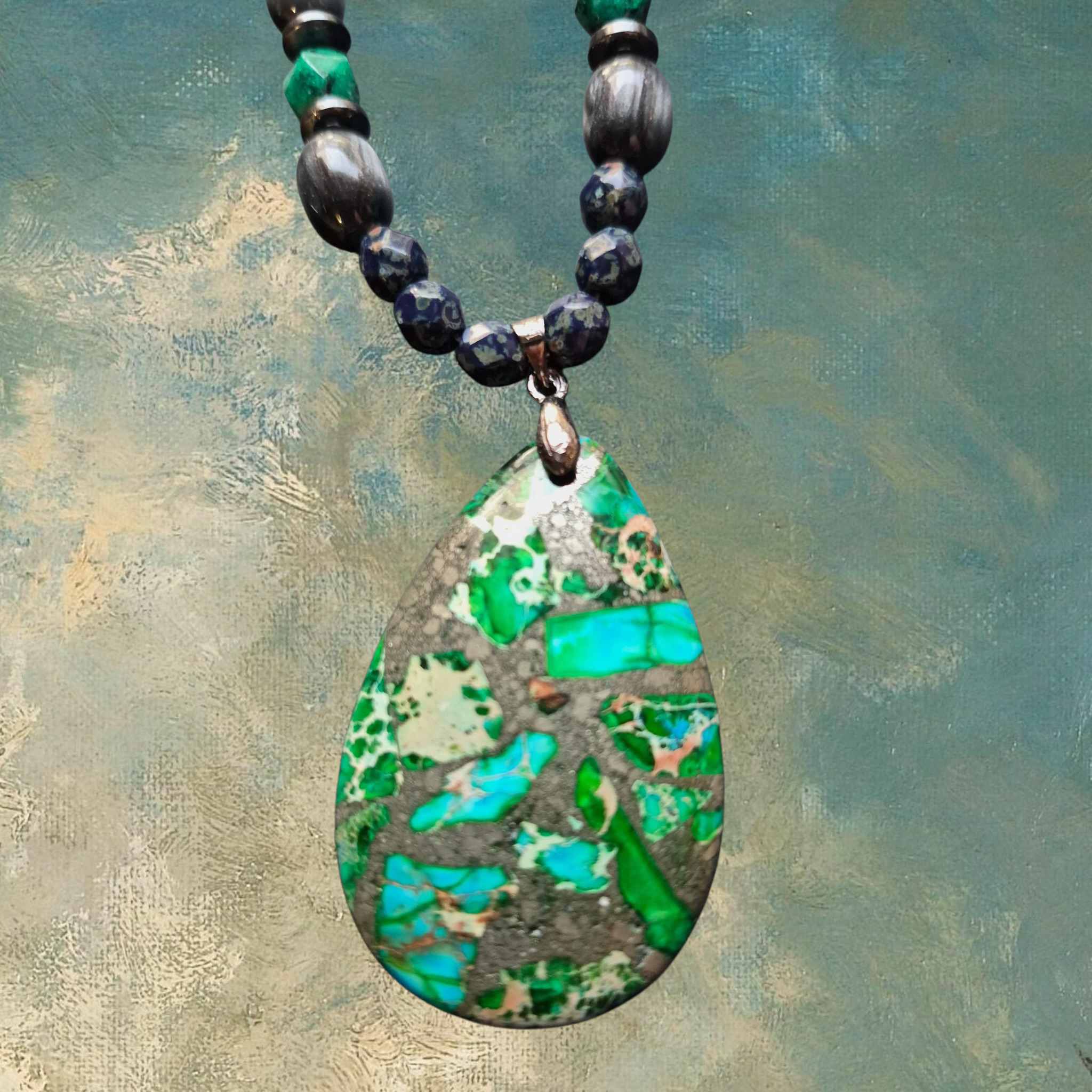 Heartfelt Creations artisan necklace with teardrop pendant in green and grey stone, accented with turquoise and lapis lazuli beads.