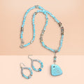 Heartfelt Creations artisan jewelry set with blue beaded necklace, organic pendant, and matching drop earrings.