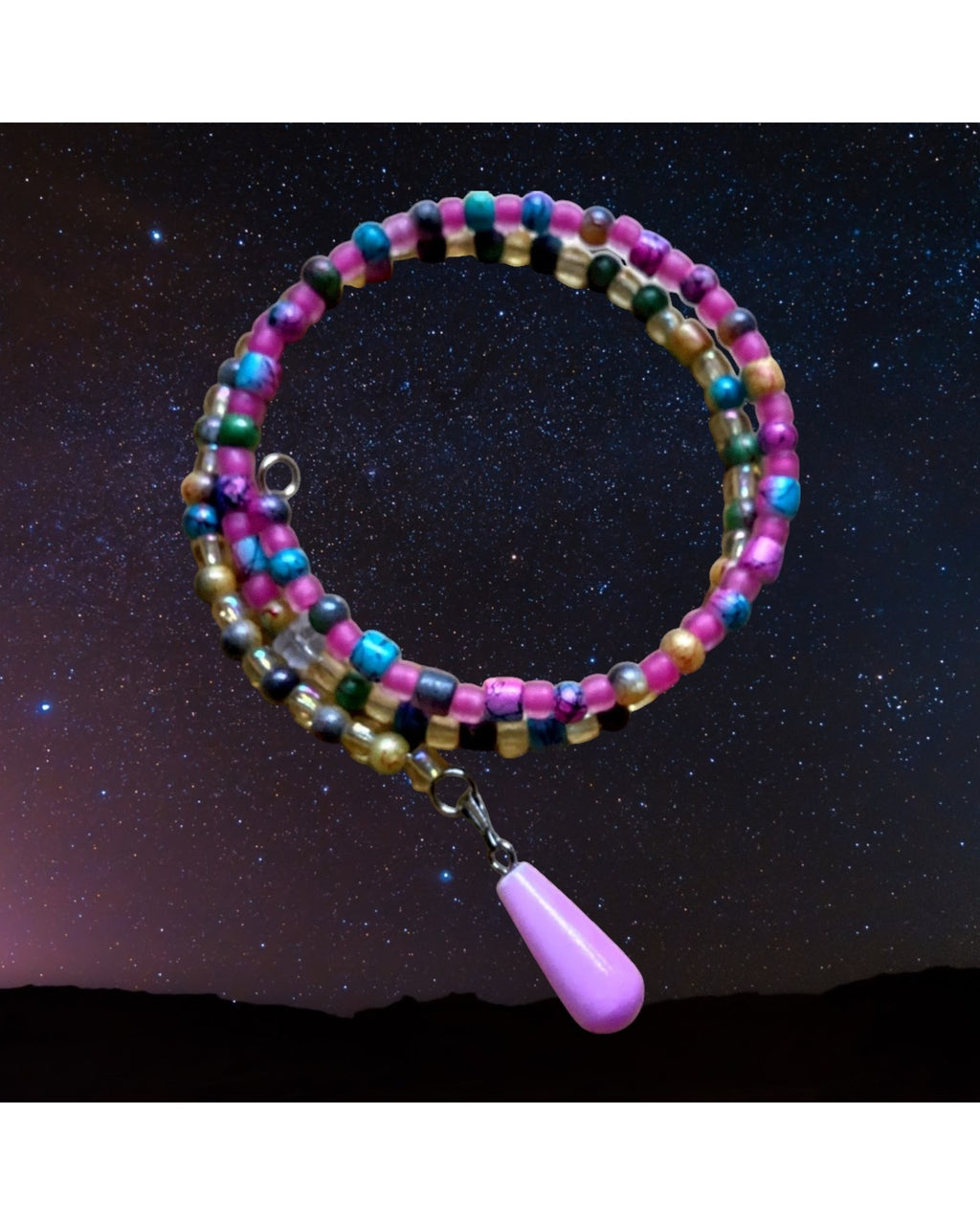 Heartfelt Creations multi-colored beaded coil bracelet with pink, turquoise, and gold beads, featuring a silver-tone charm with a lavender teardrop pendant.