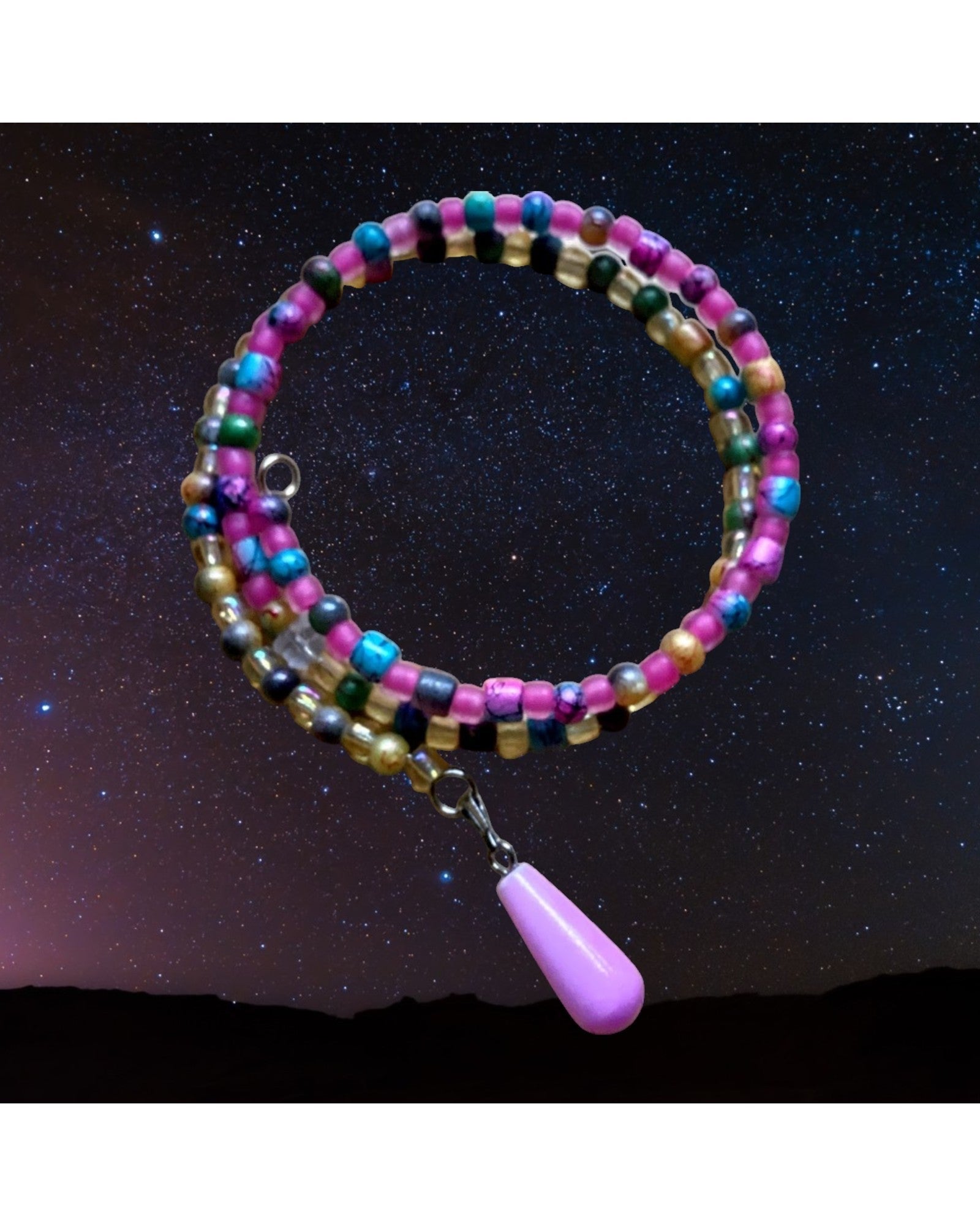 Heartfelt Creations multi-colored beaded coil bracelet with pink, turquoise, and gold beads, featuring a silver-tone charm with a lavender teardrop pendant.