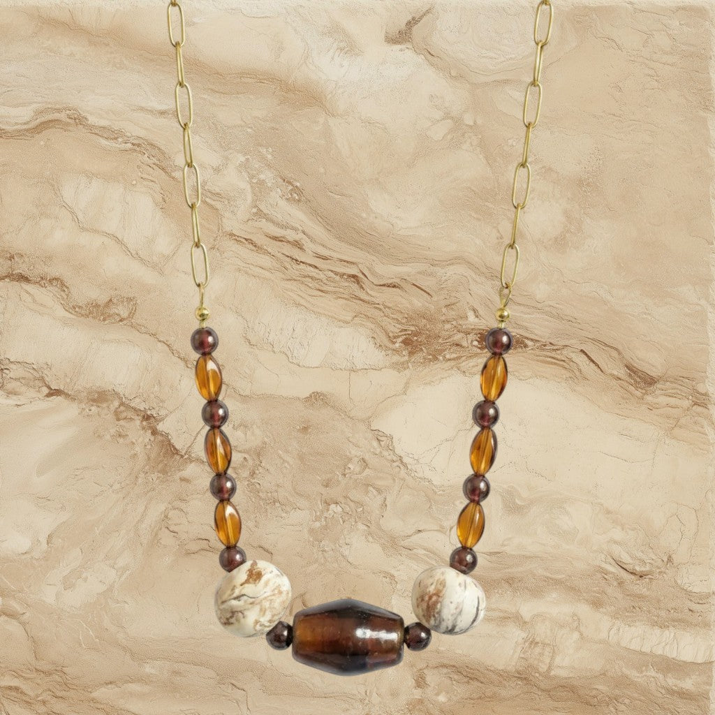 Heartfelt Creations bohemian statement necklace with translucent brown, cream, and amber beads on a gold-tone chain.