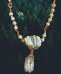 Heartfelt Creations handcrafted necklace with sage and cream sea-glass stones, copper wire wrapping, and pearl beads.