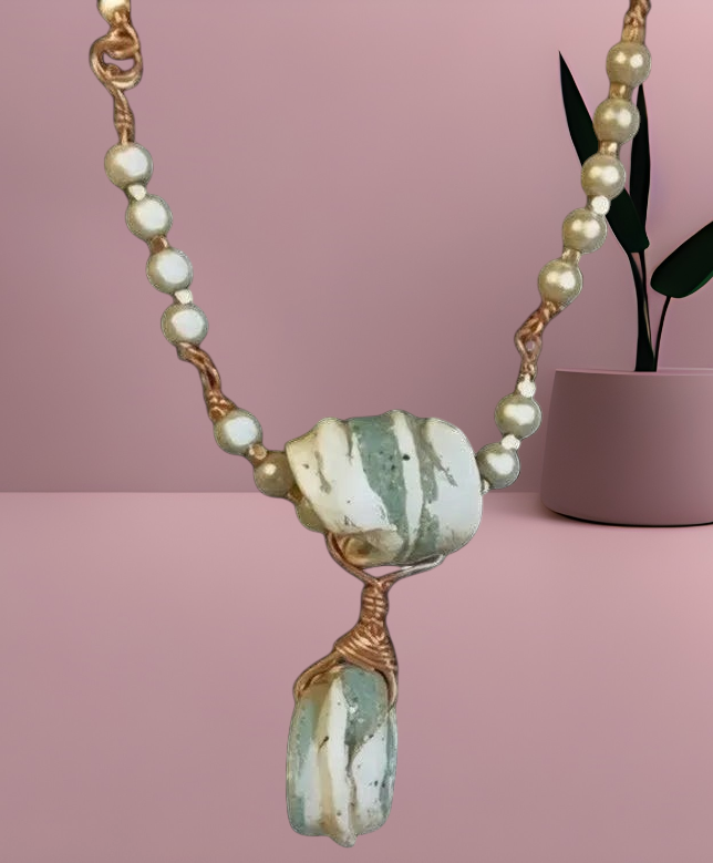 Heartfelt Creations handcrafted artisan necklace with sage and cream sea-glass stones, copper wire, and pearl accents.