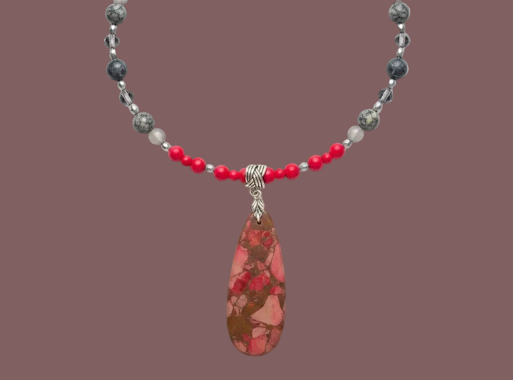 Heartfelt Creations beaded necklace featuring a marbled red teardrop pendant with red, grey, and stone beads.