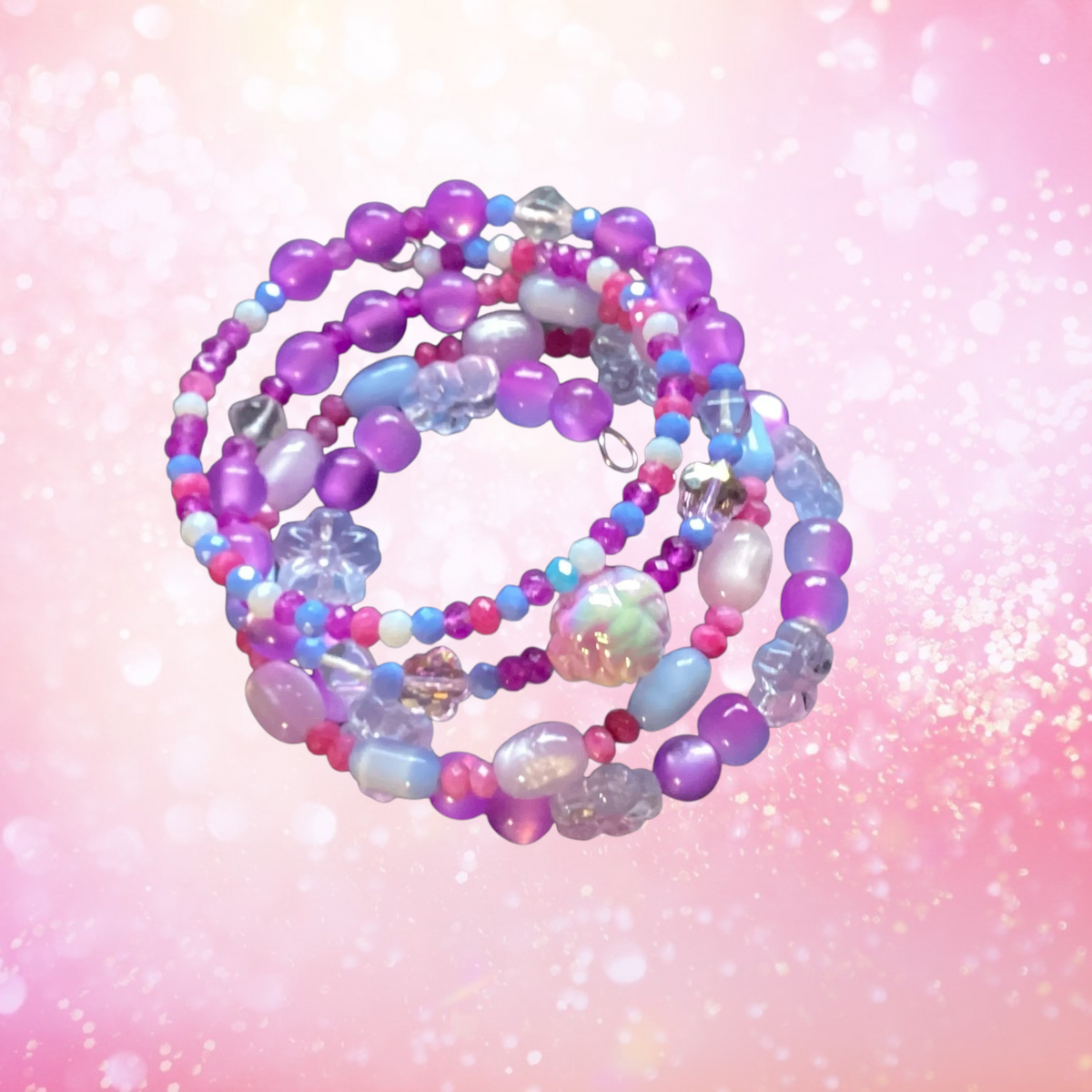 Heartfelt Creations 4-layer wrap bracelet with purple, pink, and blue beads and translucent flower charms.