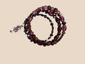 Heartfelt Creations wrap bracelet with burgundy, rose, and blue beads and a silver lizard charm.