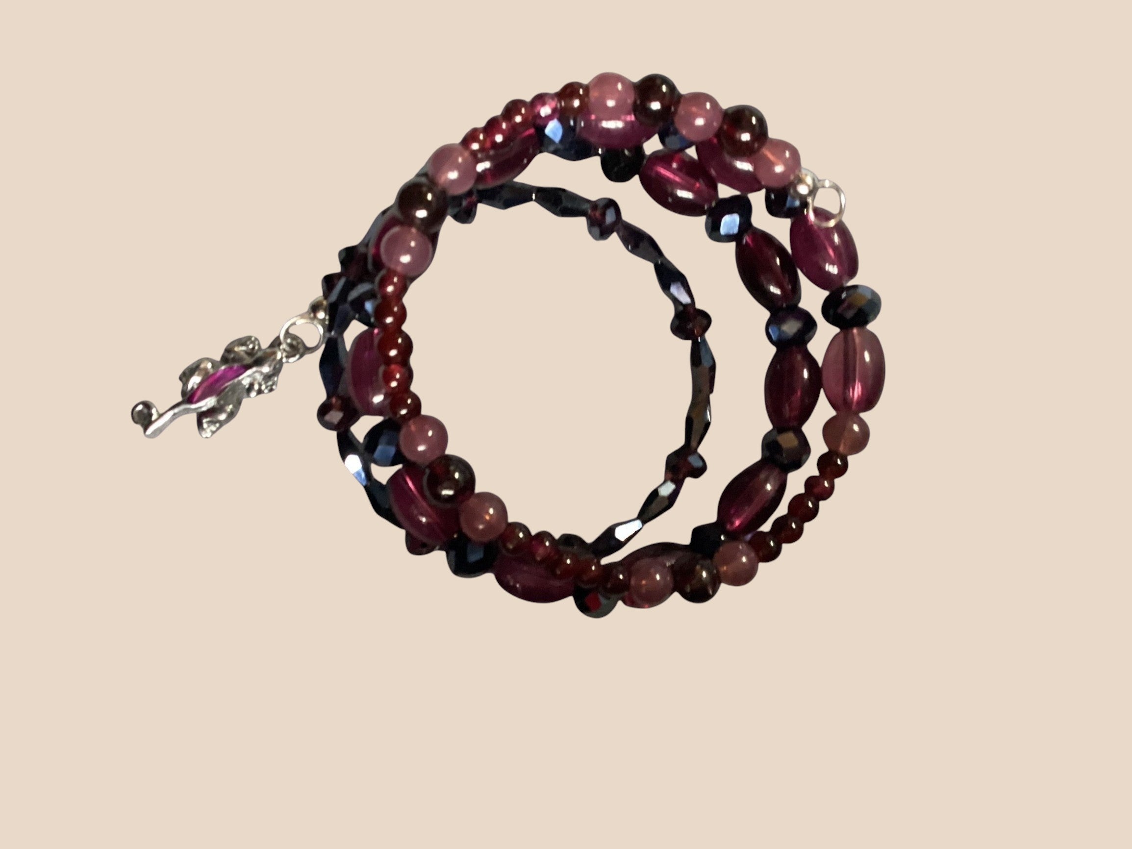 Heartfelt Creations wrap bracelet with burgundy, rose, and blue beads and a silver lizard charm.