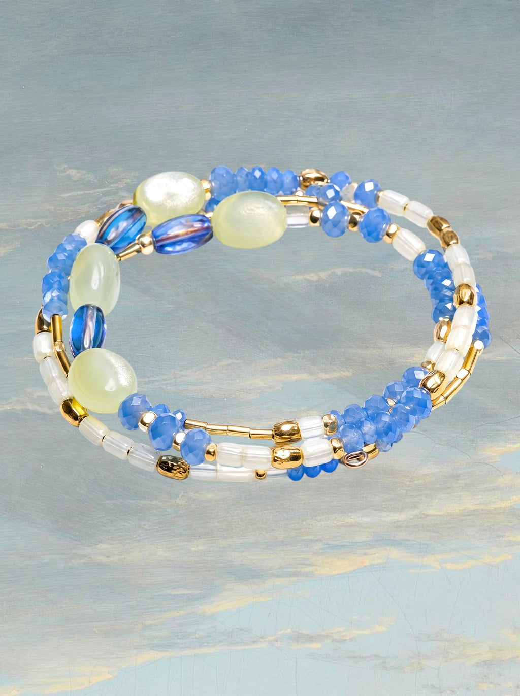 Heartfelt Creations multi-strand wrap bracelet with blue faceted beads, clear accents, and gold-tone spacers