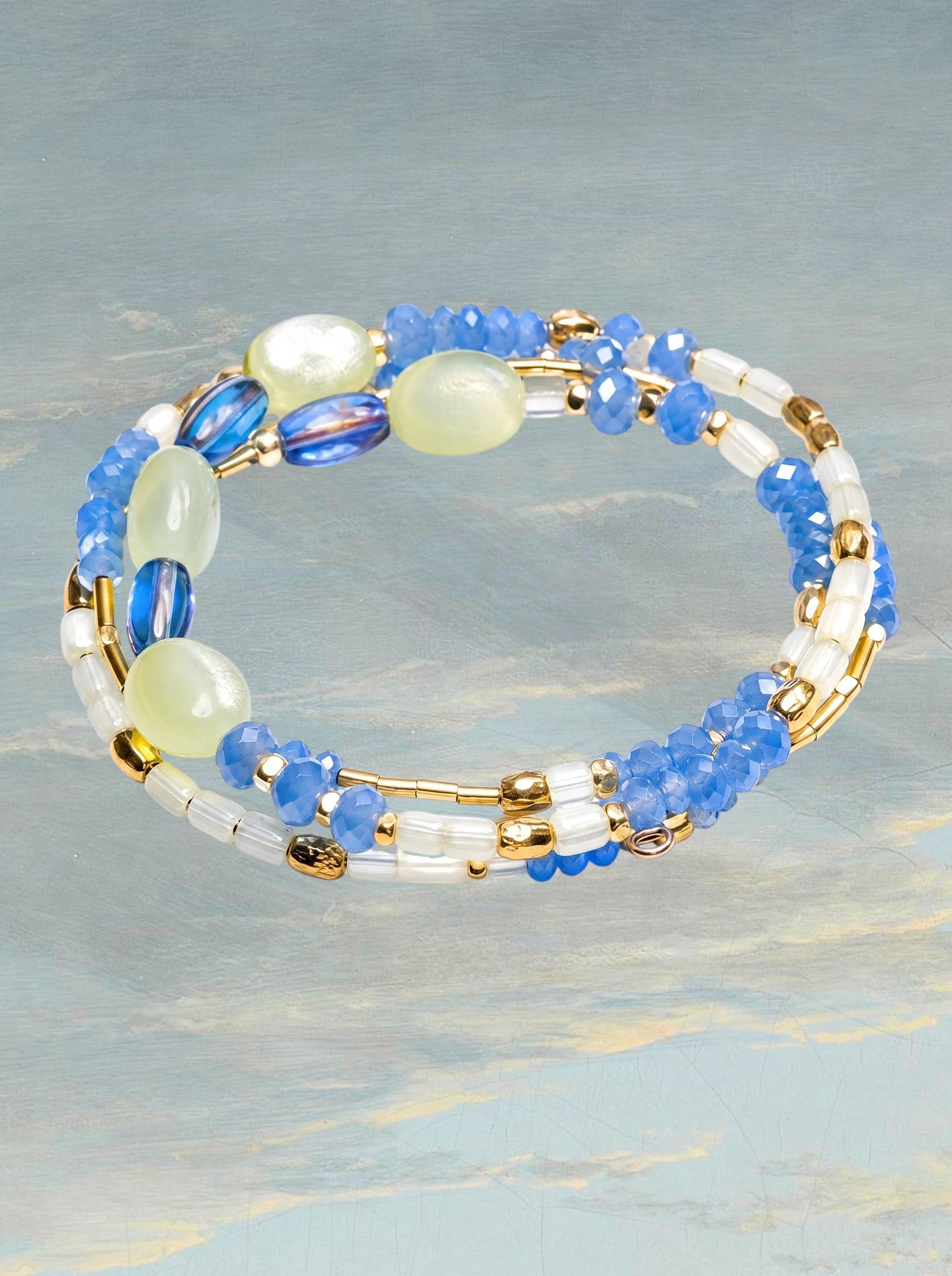 Heartfelt Creations multi-strand wrap bracelet with blue faceted beads, clear accents, and gold-tone spacers