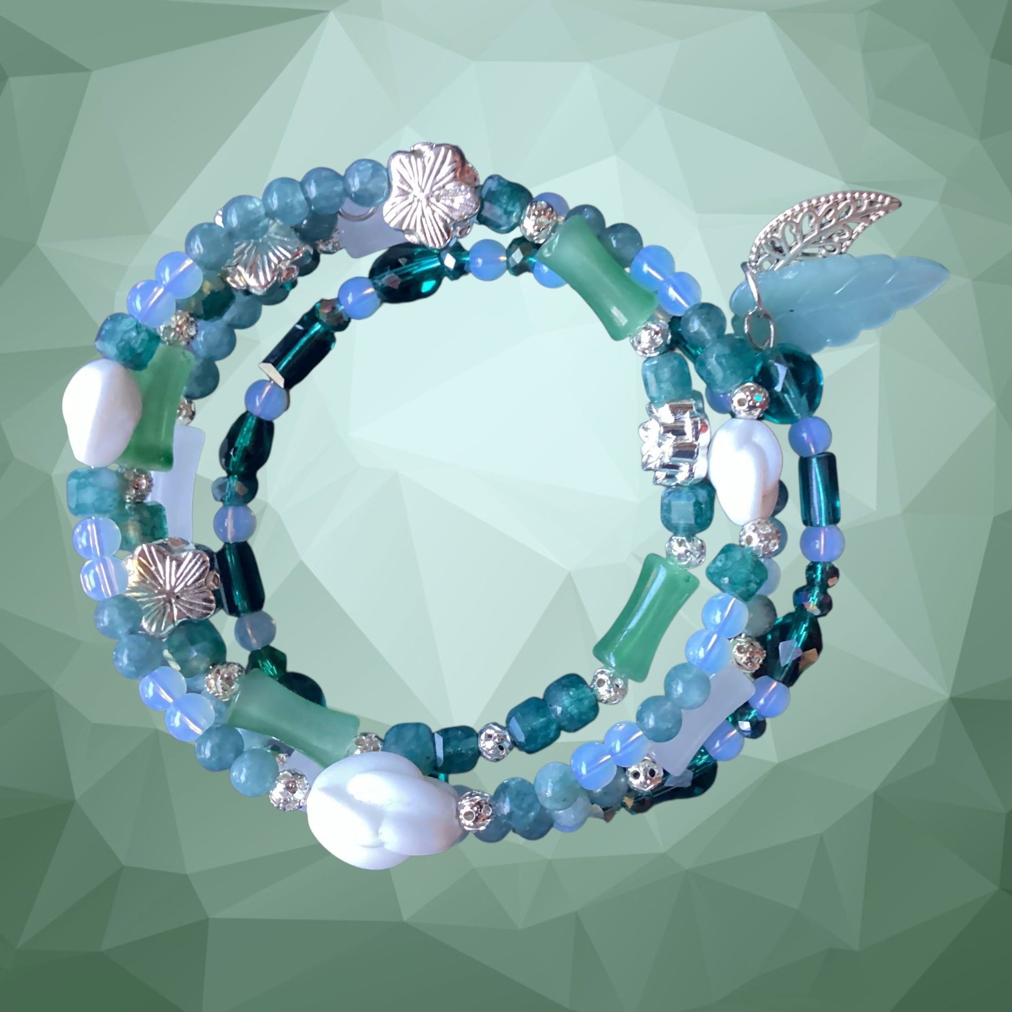 Heartfelt Creations bohemian wrap bracelet with teal, turquoise, and seafoam beads, silver flower and leaf charms.