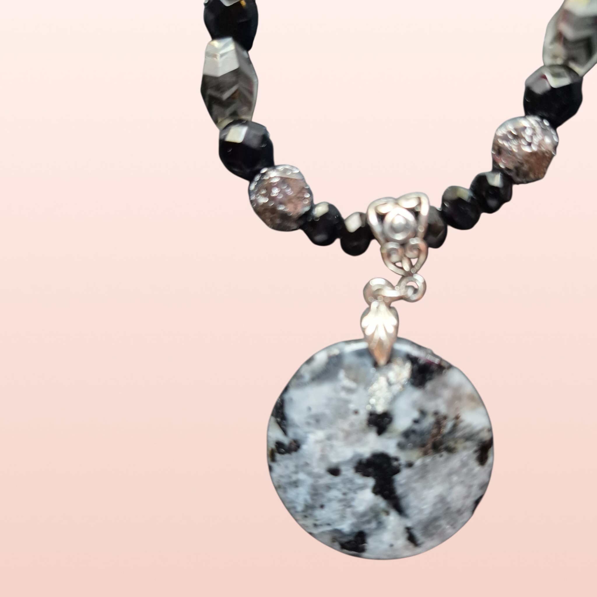 Heartfelt Creations black and silver beaded necklace with marbled pendant and matching dangle earrings.