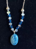 Heartfelt Creations oval blue agate pendant necklace with faceted blue and clear beads and silver-tone spacers.