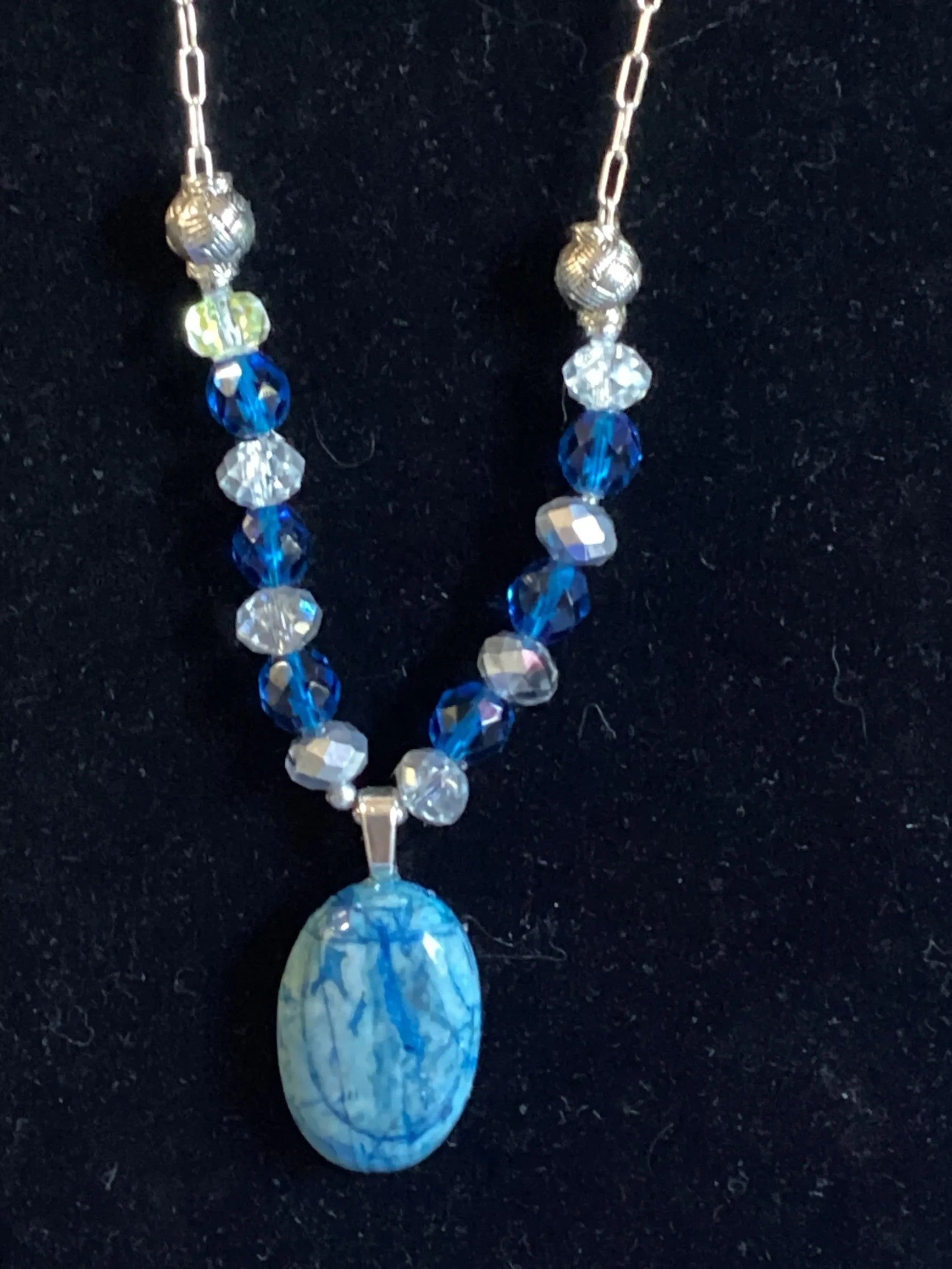 Heartfelt Creations oval blue agate pendant necklace with faceted blue and clear beads and silver-tone spacers.